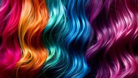Vibrant multicolored wavy hair strands in pink, orange, turquoise, blue and purple shades creating dynamic pattern for hair salon and beauty industry designs.