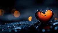 Orange glowing heart shape with water drops against dark background with bokeh lights, romantic mood for Valentine's day and love concepts.