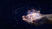 Hands holding glowing geometric shapes with digital network connections on dark blue background for technology and innovation concepts.