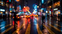 Blurred city street at night with colorful bokeh lights reflecting on wet pavement, creating atmospheric urban scene with pedestrians and traffic.