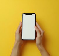 Female hands holding modern smartphone with blank white screen against vibrant yellow background, mockup for app or website presentation.