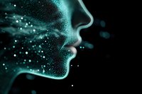 Glowing turquoise profile of face dissolving into particles against dark background, representing artificial intelligence, technology transformation and digital identity.