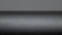 Dark gray metallic surface with subtle texture and gradient lighting for industrial design backgrounds and modern presentations.