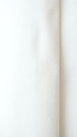 Soft beige fabric texture with natural folds and creases creating elegant drapery effect for interior design and textile applications.