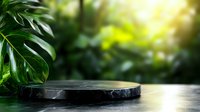 Black marble stone podium on blurred tropical green monstera leaves background with natural sunlight for product display or presentation.