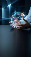 Hands holding glowing digital globe with blue and orange light trails in modern office environment, representing global connectivity, technology innovation, and business solutions.