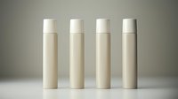 White minimalist cosmetic bottles standing in row on neutral background, mockup for skincare and beauty product packaging design. Clean modern style presentation.