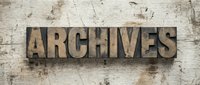 Vintage letterpress wood type spelling Archives on rustic grunge wooden background, perfect for history, library, and document storage concepts.