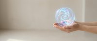Hands holding glowing holographic sphere with swirling energy patterns for technology, innovation and futuristic concepts in business presentations.