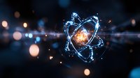 Glowing atomic structure with orbiting electrons in blue light against dark background, energy particles and bokeh effects create scientific atmosphere.