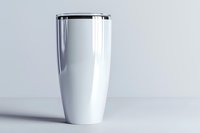 White stainless steel tumbler with black lid on light background, modern minimalist travel mug mockup for branding and design presentation.