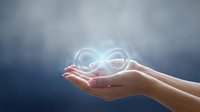 Hands holding glowing infinity symbol representing endless possibilities, sustainability, and continuous growth for business, technology, and corporate concepts.