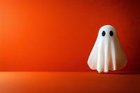 White ghost figure on vibrant orange background, minimalist Halloween decoration with dramatic lighting and clean composition for seasonal designs and party invitations.