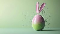 Easter egg with pink bunny ears on pastel green background for spring holiday celebration and festive decoration projects.