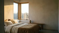 Serene bedroom corner with natural light streaming through large windows, minimalist bed with neutral bedding, wooden frame, and simple decor for relaxation.