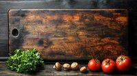 Fresh tomatoes, mushrooms and parsley on rustic wooden cutting board with dark textured background, food photography composition with copy space.