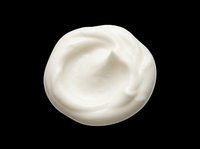Creamy white cosmetic product swirl isolated on transparent background, ready for skincare, beauty, and wellness design projects including packaging, labels, and digital marketing materials.