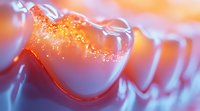 Macro view of dental anatomy showing tooth enamel surface with orange backlight creating dramatic glow effect, highlighting oral healthcare and dentistry concept.