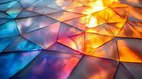 Colorful geometric pattern with triangular shapes in vibrant blue, orange and purple hues creating dynamic light effects and reflective surface texture. Macro photography.