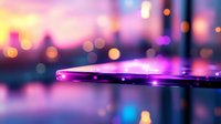 Futuristic purple and pink bokeh lights reflecting on glossy surface with blurred city background creates dreamy atmospheric mood for technology concepts.