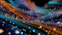 Abstract colorful light trails with glowing bokeh effect on dark background, creating dynamic motion and energy for technology or communication concepts.