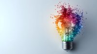 Colorful light bulb with exploding rainbow particles and musical notes creating artistic splash effect on gray background. Creative concept for innovation.