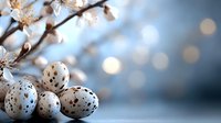 Speckled quail eggs against blurred spring background with white cherry blossoms and soft bokeh lights creating dreamy natural composition.
