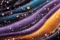 Abstract cosmic waves in purple, blue and orange with glowing particles and bokeh effects create mesmerizing galactic pattern. Suitable for space-themed designs.