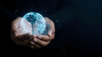 Hands holding glowing digital brain with circuit patterns on dark background, representing artificial intelligence, technology innovation, and data processing for tech concepts.