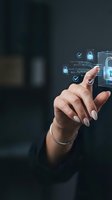Woman interacting with digital security interface displaying holographic padlock icons and checkmarks on smartphone, representing cybersecurity, data protection, and mobile authentication technology.