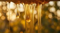 Golden honey dripping from wooden dipper with warm bokeh background, natural sweetness flowing in amber streams for culinary and wellness applications.