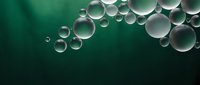 Transparent water bubbles floating on emerald green background creating abstract liquid pattern for modern design projects and digital artwork applications.