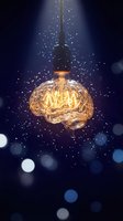 Glowing brain-shaped light bulb hanging against dark blue background with sparkling particles and bokeh effects representing creativity and innovation.
