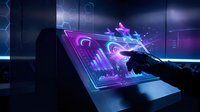 Futuristic holographic interface with glowing purple data visualization emerging from tablet screen in dark tech environment for digital innovation concepts.