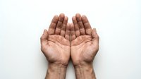 Open cupped hands gesture showing palms up in receiving position against white background for prayer, giving, offering concepts.