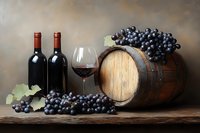 Wine tasting setup with red wine bottles, glass, wooden barrel and fresh dark grapes on rustic table for vineyard marketing and restaurant menus.