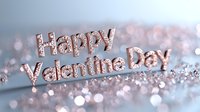Happy Valentine's Day text in rose gold glitter letters on blurred bokeh background with sparkles and soft pink romantic lighting effects.