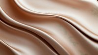 Smooth flowing waves of luxurious milk chocolate create elegant curves and swirls against light background, showcasing rich texture and glossy finish for food industry use.