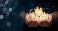 Cupped hands holding glowing golden family silhouettes with magical sparkles and bokeh lights on dark blue background for insurance and protection concepts.