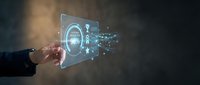 Hand touching holographic padlock interface with digital security particles dispersing, representing cybersecurity, data protection, and encrypted technology solutions for business applications.
