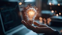 Glowing light bulb with digital network connections floating above open palm against blurred dark background with bokeh lights. Creative innovation concept.