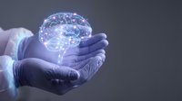 Gloved hands holding glowing digital brain with neural networks for medical technology and artificial intelligence concepts.