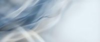 Soft abstract flowing fabric waves in cool blue and white tones, creating an ethereal motion effect suitable for backgrounds and design overlays.