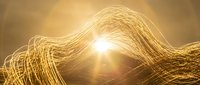 Golden light trails creating flowing wave patterns with bright luminous energy burst for digital art and technology backgrounds.