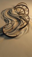 Abstract clock face dissolving into flowing liquid waves on sandy surface representing time passage and temporal fluidity concepts for creative projects.