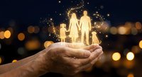 Protective hands holding glowing family silhouettes with magical sparkles against warm bokeh lights background for insurance and care concepts.
