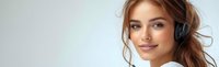 Young Caucasian woman customer service representative wearing headset with microphone smiling professionally in modern office environment for business.