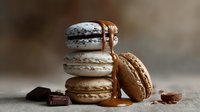 Gourmet macarons with caramel drizzle and chocolate pieces on rustic wooden surface, French pastry dessert for bakery menu and culinary photography.