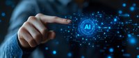 Businessman finger touching glowing AI symbol with network connections on dark background. Digital transformation and machine learning concept.