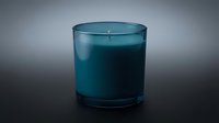 Elegant teal scented candle in glass holder on dark surface for home decor, aromatherapy, relaxation and spa atmosphere.